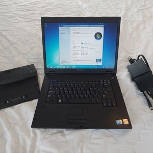 Dell E5500 laptop and charger and docking station